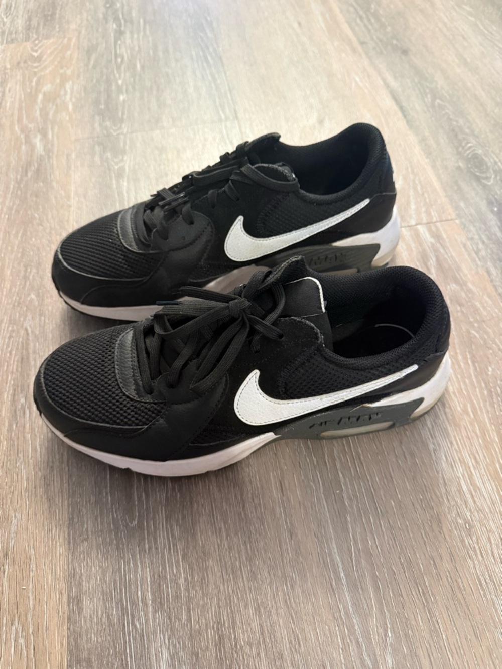 Nike Women’s Black Sneakers with White Swoosh
